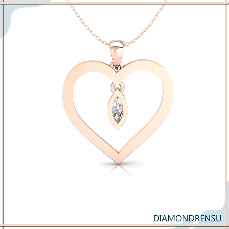 White gold pendant with marquise cut diamond and heart outline.
