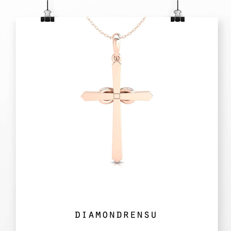 Infinity cross pendant in yellow gold with handcrafted detail.
