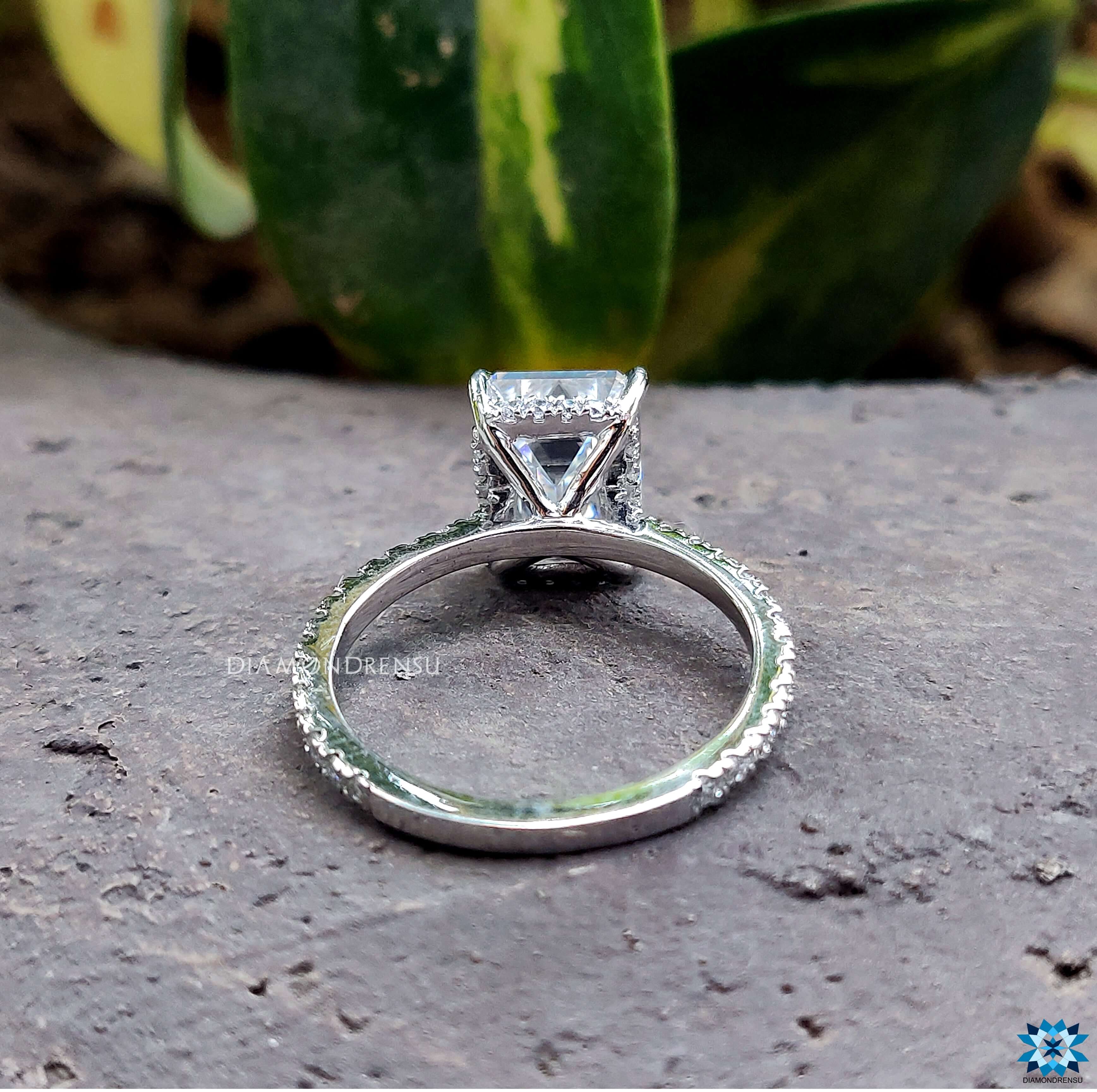 Moissanite for engagement ring in a beautifully crafted emerald cut ring setting.