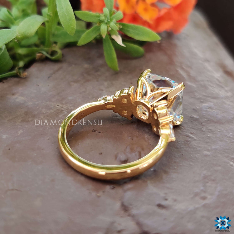 Diamondrensu UK engagement ring with cushion moissanite in a classic muse setting.
