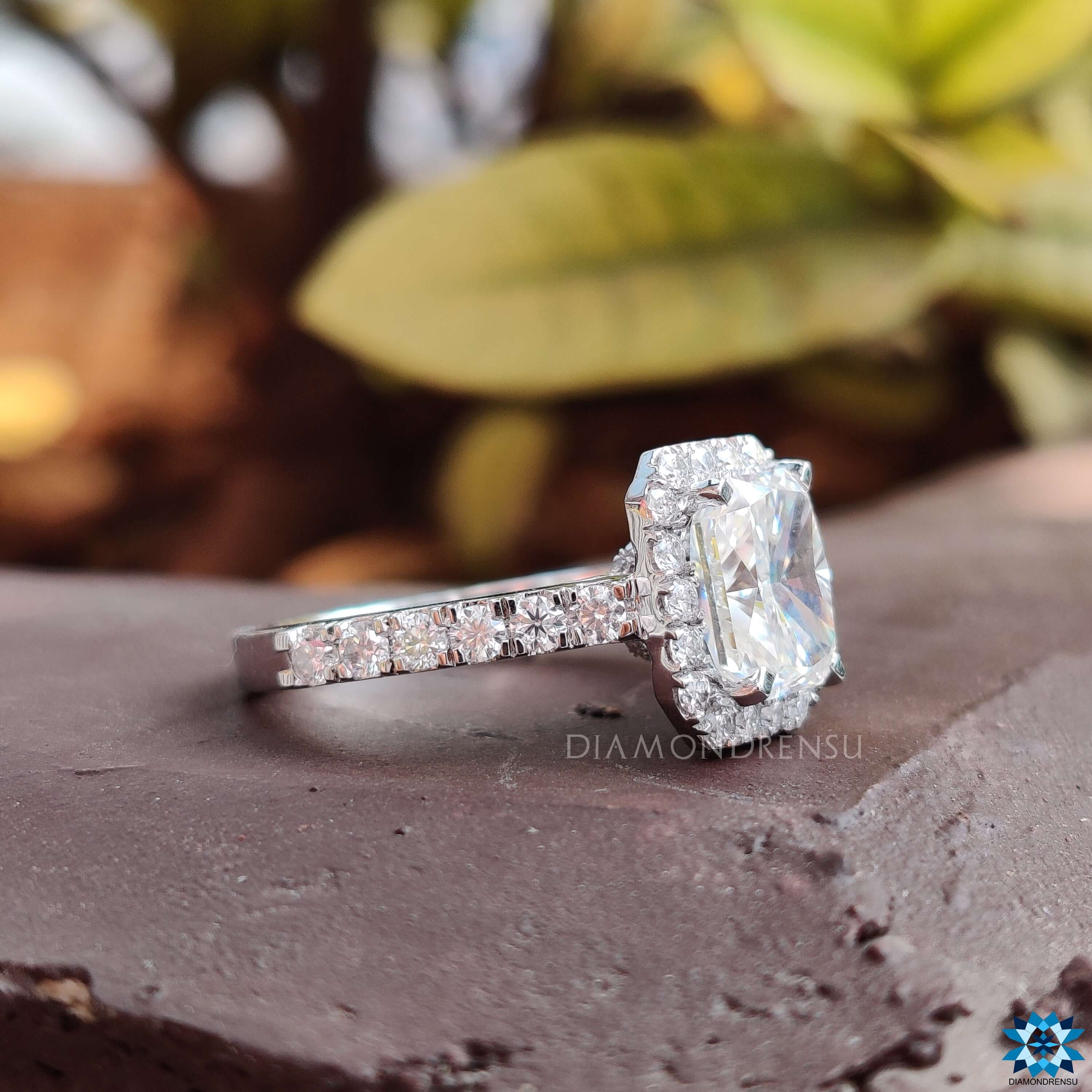 Prong setting ring securing a radiant cut moissanite for maximum brilliance.