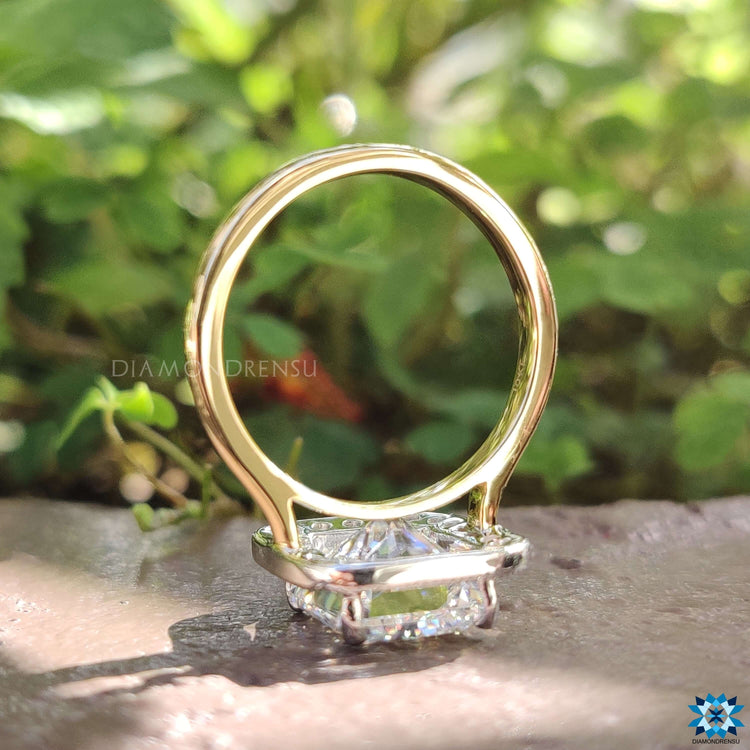 Cathedral setting ring with halo and radiant moissanite.
