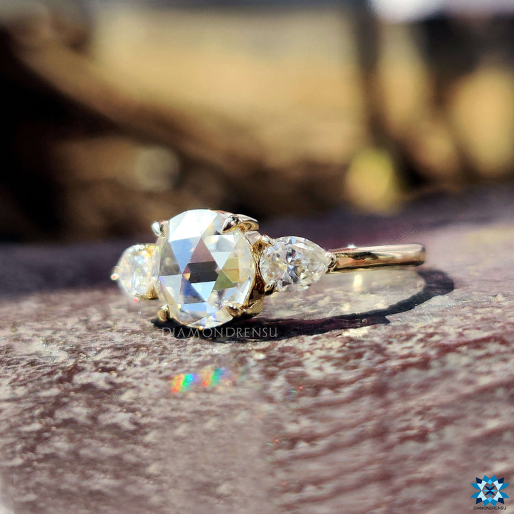 Handmade round rose cut engagement ring with pear accents.
