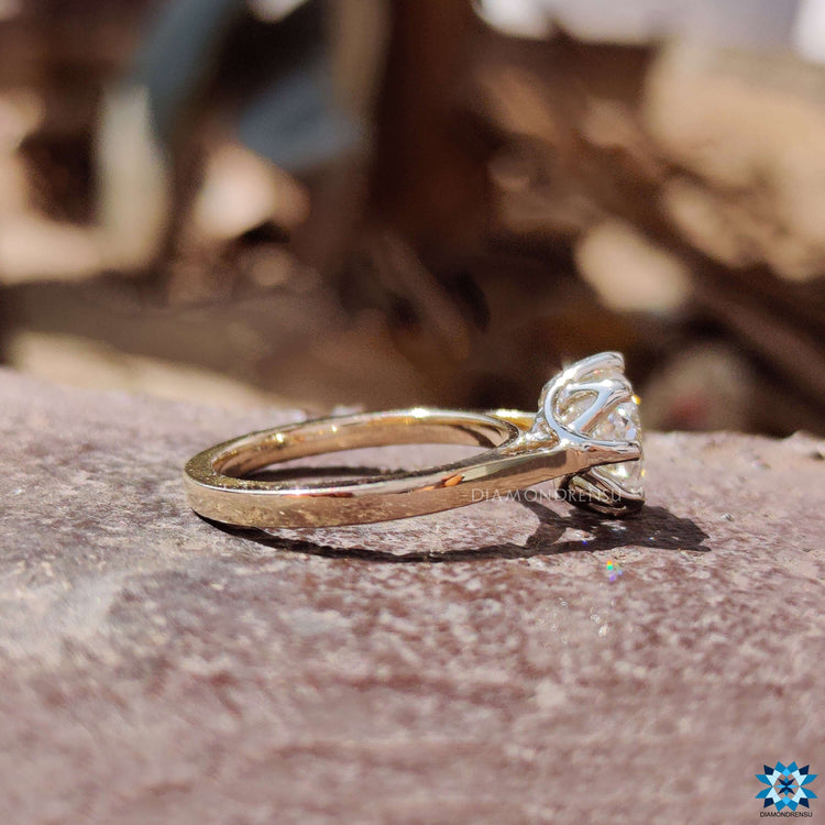 8 prong setting on yellow gold engagement ring.
