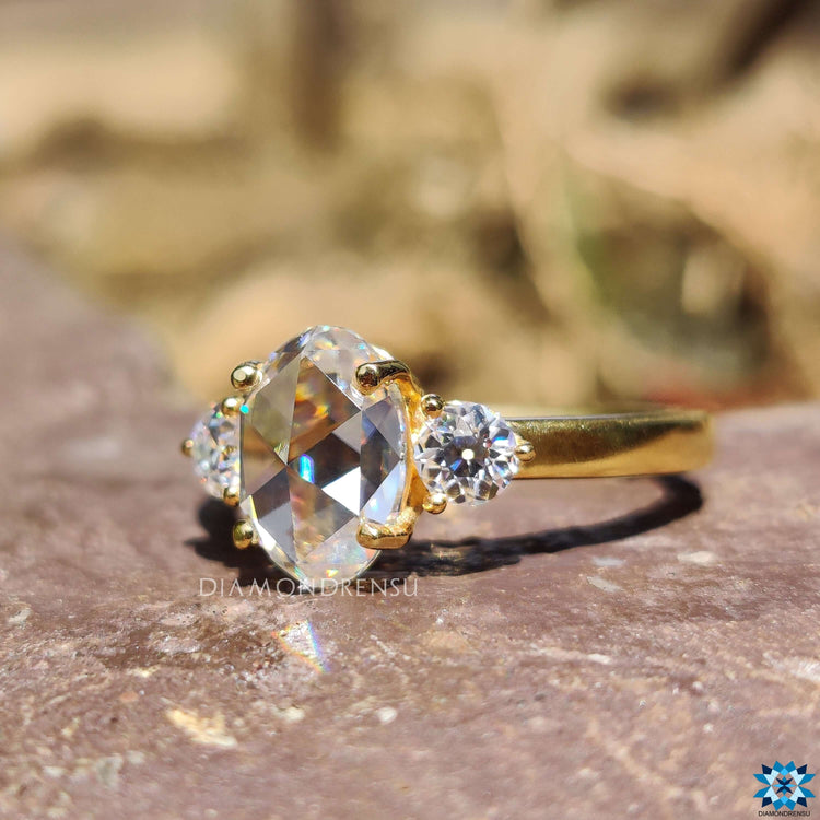 Handmade three stone moissanite ring with prong setting.
