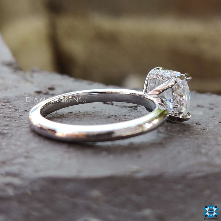 Four prong hidden halo moissanite engagement ring.
