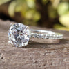 Moissanite Engagement Ring featuring a round cut moissanite ring design.