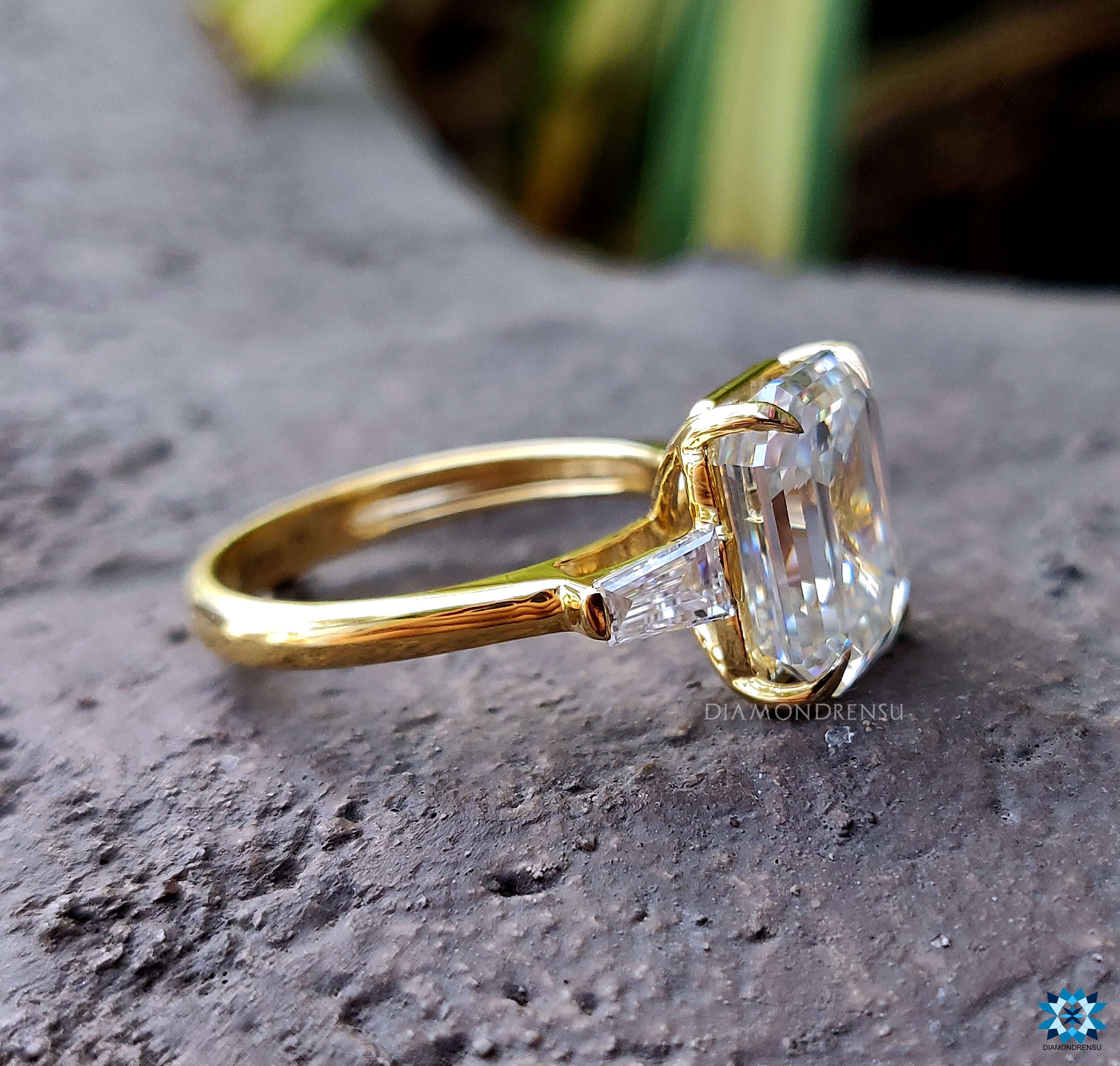 Emerald Cut Moissanite Ring with tapered baguette ring accents.