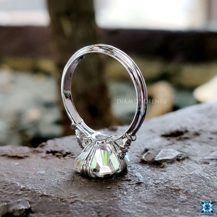 Custom engagement ring with radiant cut and antique design.
