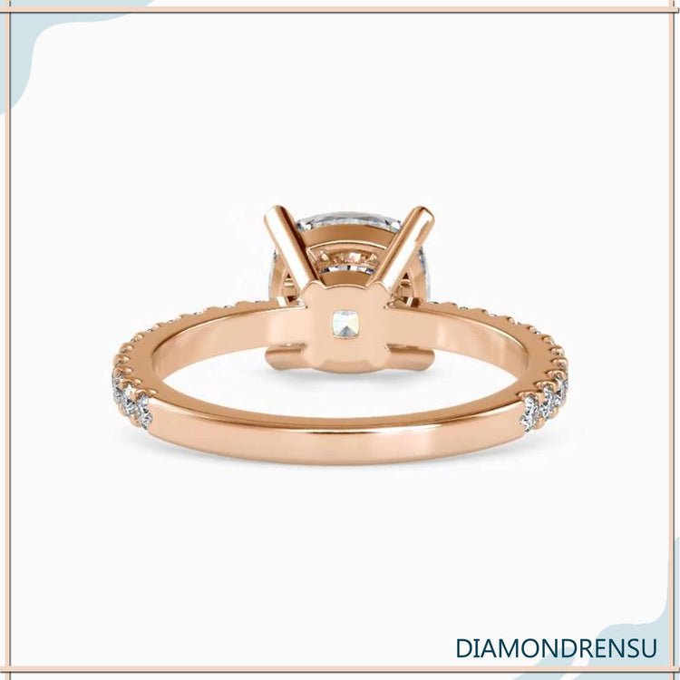 Lab diamond ring with round side stones and cushion centre.

