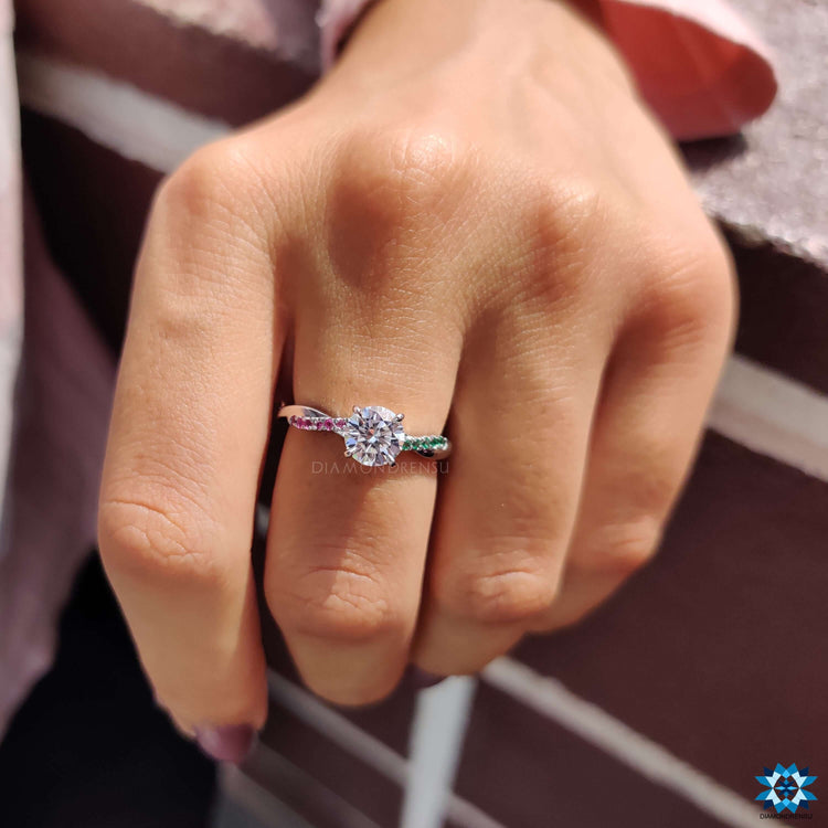 Moissanite ring with 4 prong setting and vibrant side stones.
