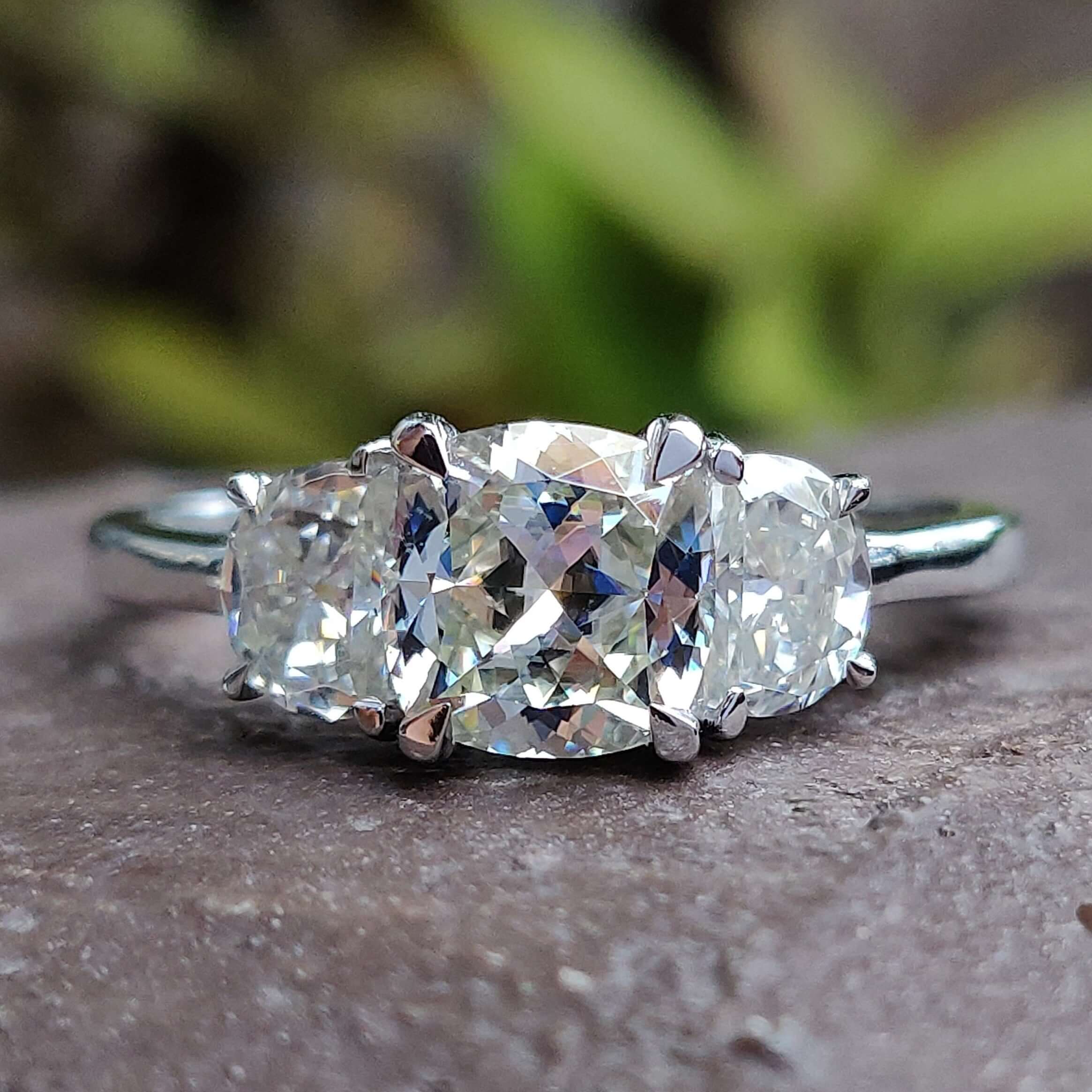 Cushion Cut Engagement Ring featuring a stunning 3 stone moissanite ring design.