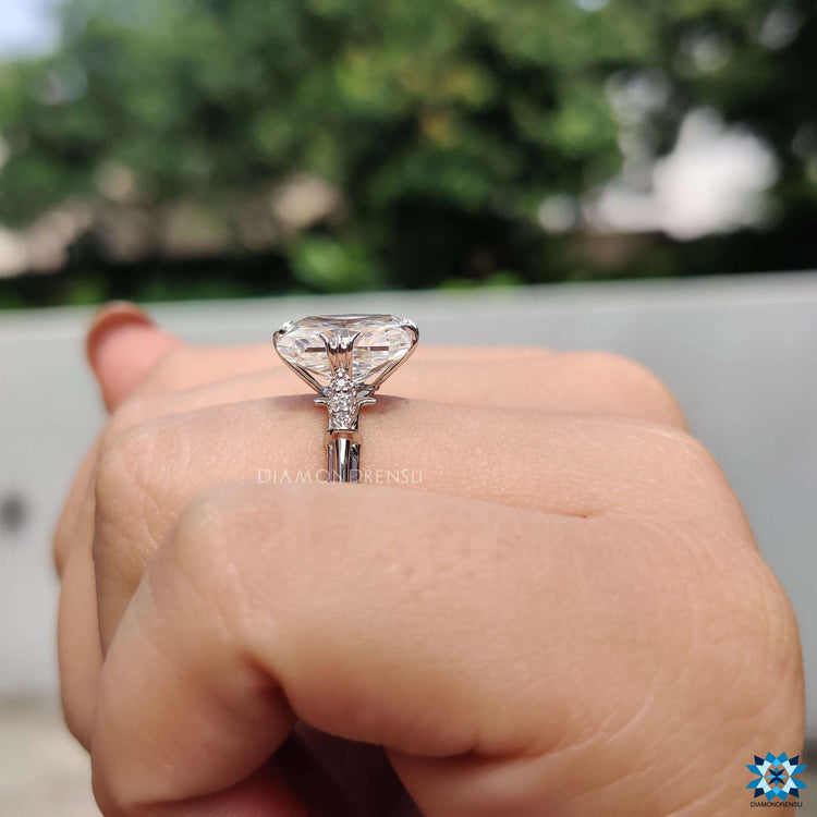 Vintage-style white gold engagement ring with radiant moissanite.
