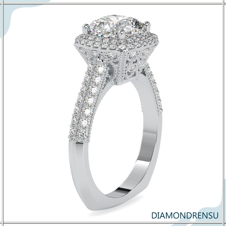 Yellow gold diamond ring with round cut halo and pave.

