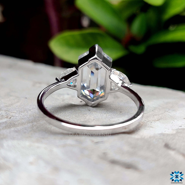 Buy moissanite hexagon engagement ring with three stones.
