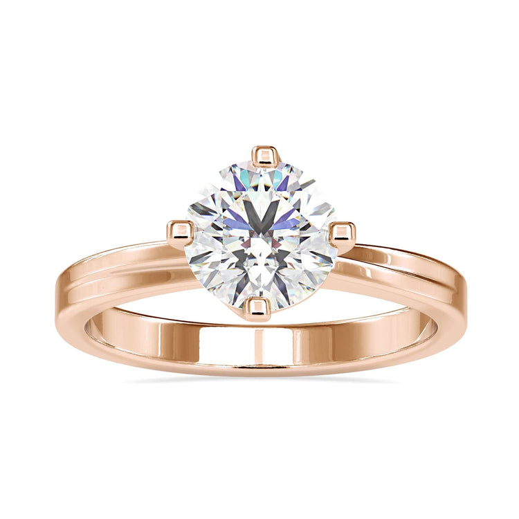 Custom design ring in rose gold with solitaire diamond.

