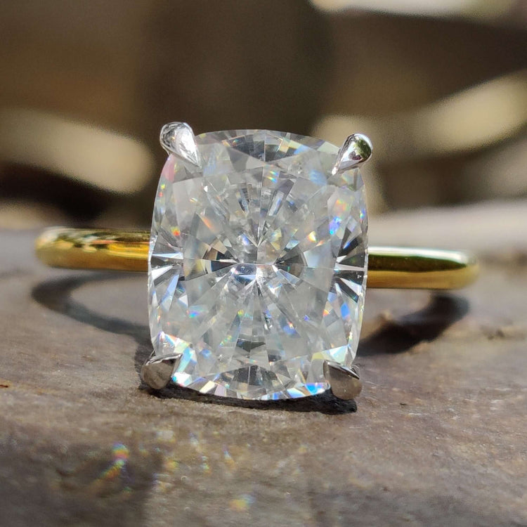 Elongated cushion cut solitaire engagement ring.

