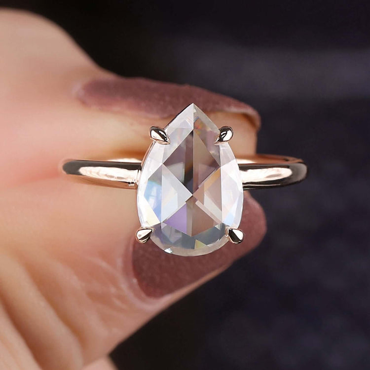 Moissanite solitaire ring with pear shaped center.
