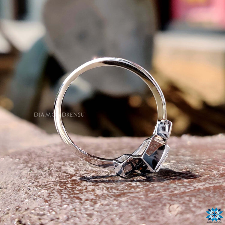 Custom handmade lozenge cut moissanite engagement ring.
