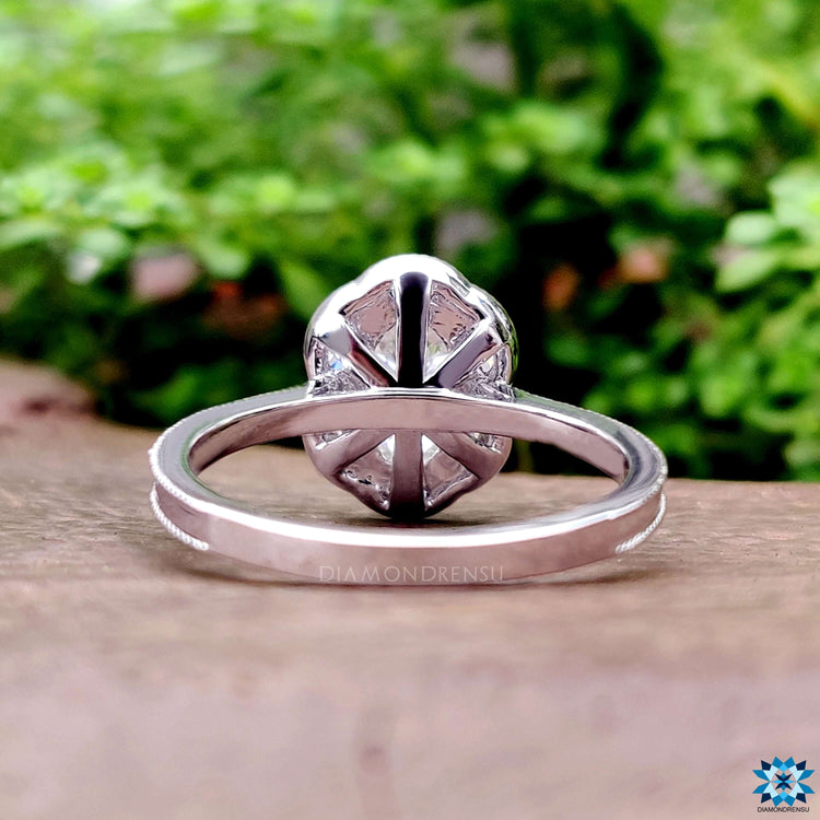 Handmade halo cluster moissanite ring with vintage design.
