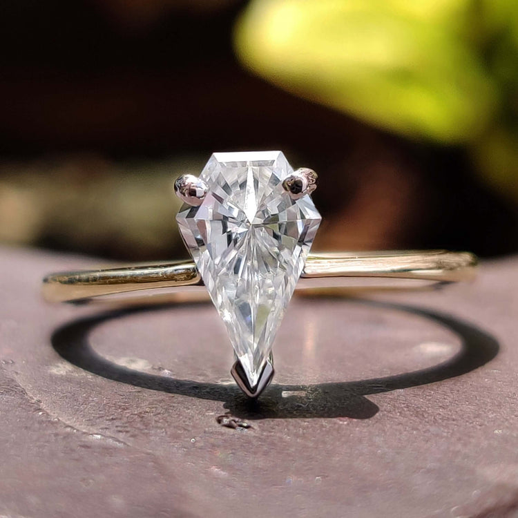 Spear cut engagement ring with solitaire design.
