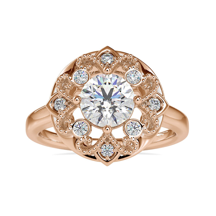 Round cut diamond ring with vintage milgrain band in yellow gold.
