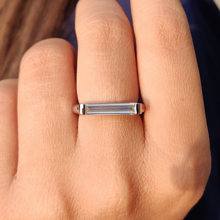 Baguette cut moissanite ring in white gold.
