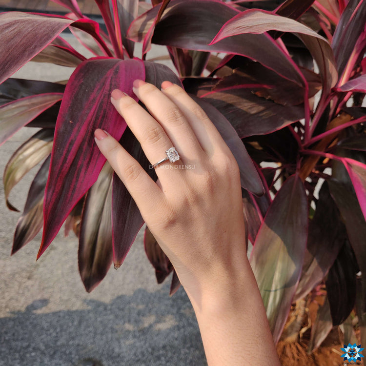 Handmade jewelry with emerald cut moissanite center.

