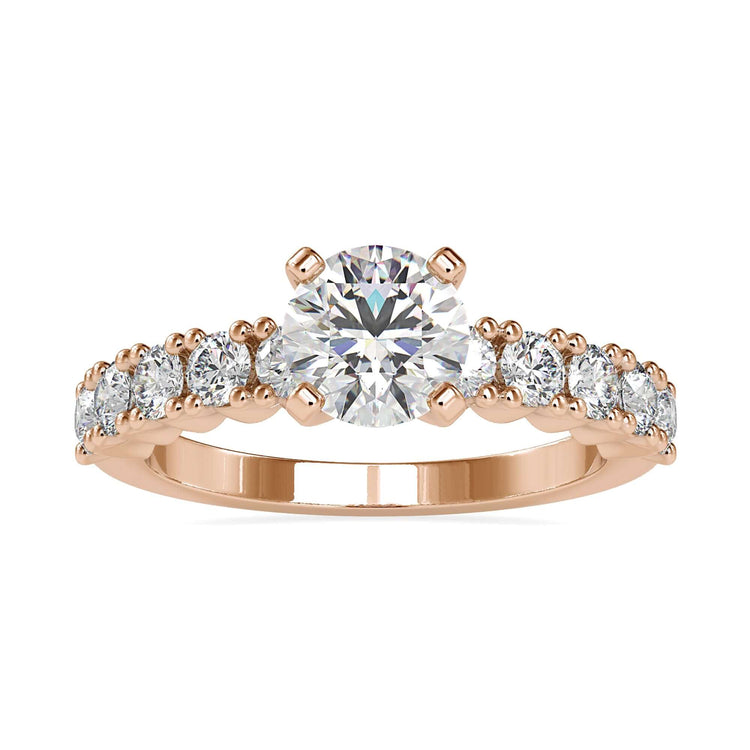 Handmade ring with round cut diamond and pave band in white gold.
