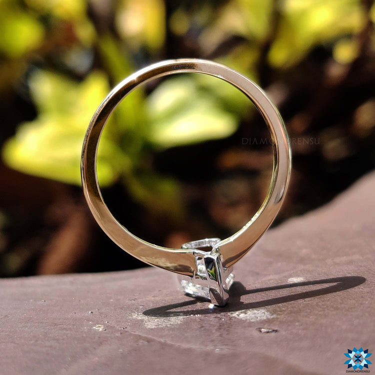Custom engagement ring featuring spear cut moissanite.
