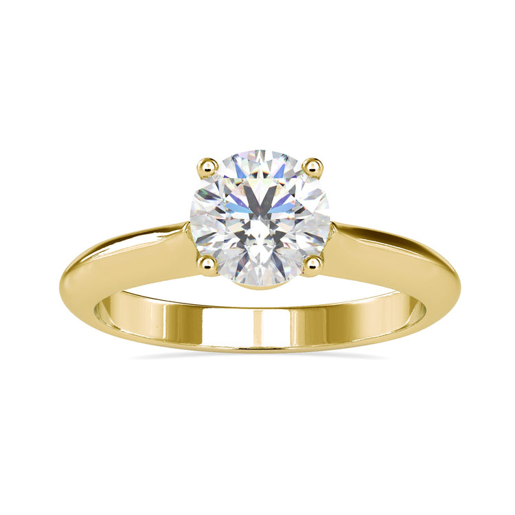 Simple diamond ring in solitaire setting, custom made in UK.
