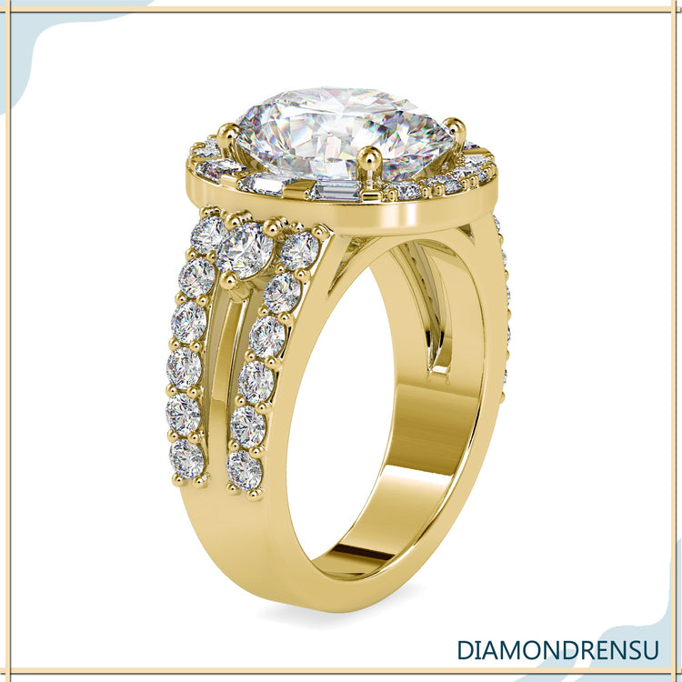 Round side stone ring with oval diamond in yellow gold.
