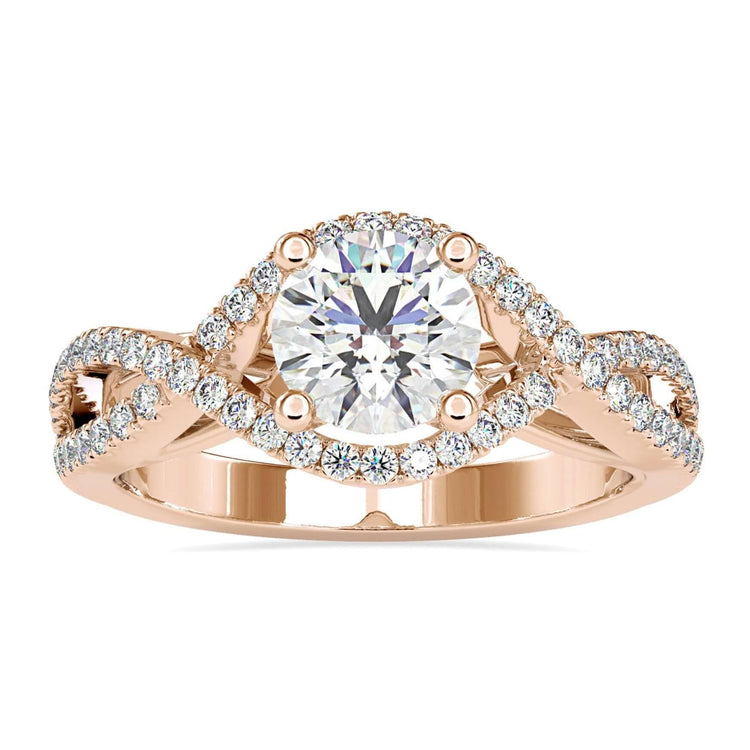 Twisted engagement ring with a round diamond in a clean, modern style.
