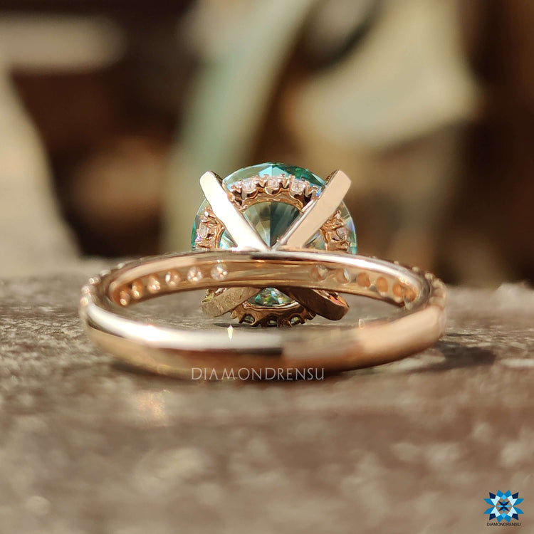 Four prong claw setting moissanite ring in rose gold.
