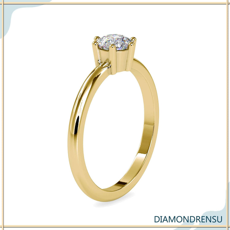White gold round diamond ring with handmade solitaire design.
