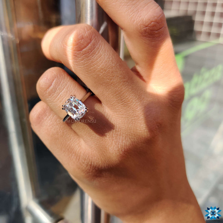 White gold solitaire ring with cushion old European cut stone.
