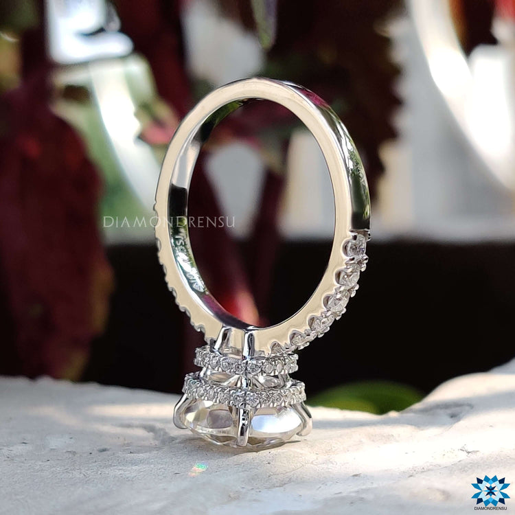 Moissanite double halo ring with round pave band.

