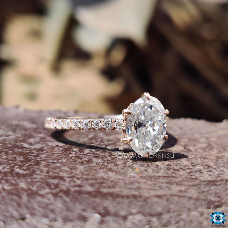 Rose gold ring with pave setting and round cut stones.
