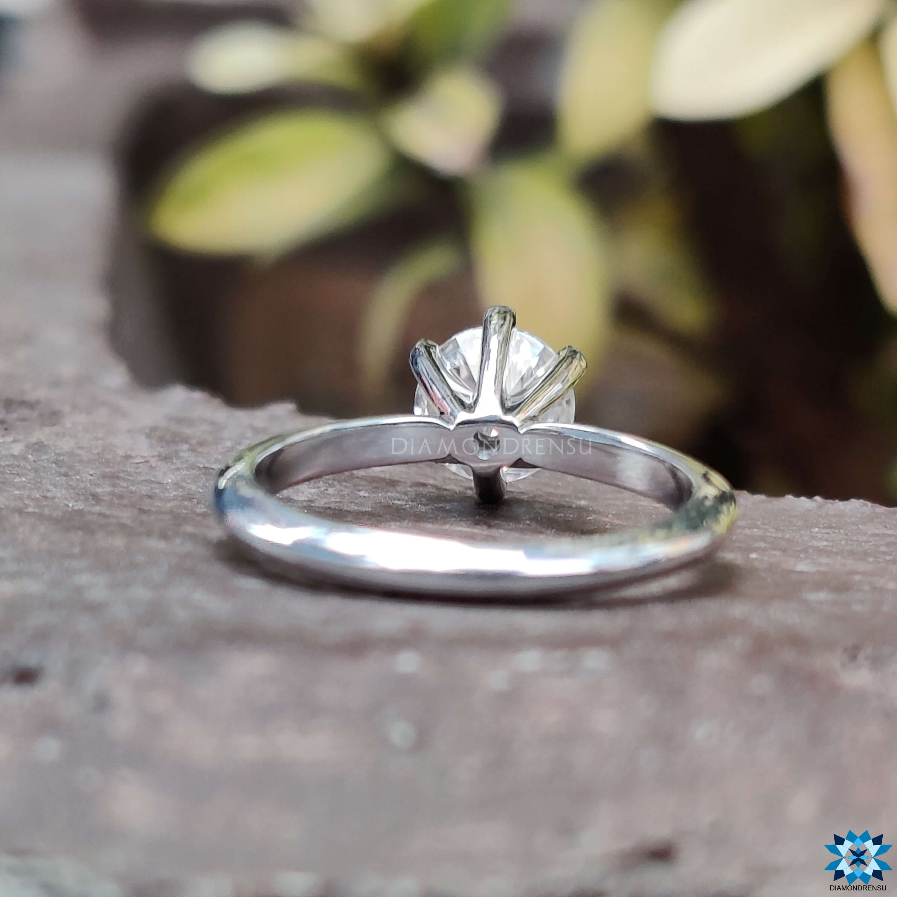 6 Prong Engagement Ring holding a stunning round cut ring with secure placement.