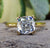 Cushion cut moissanite engagement ring with Double Prong Setting in yellow gold.
