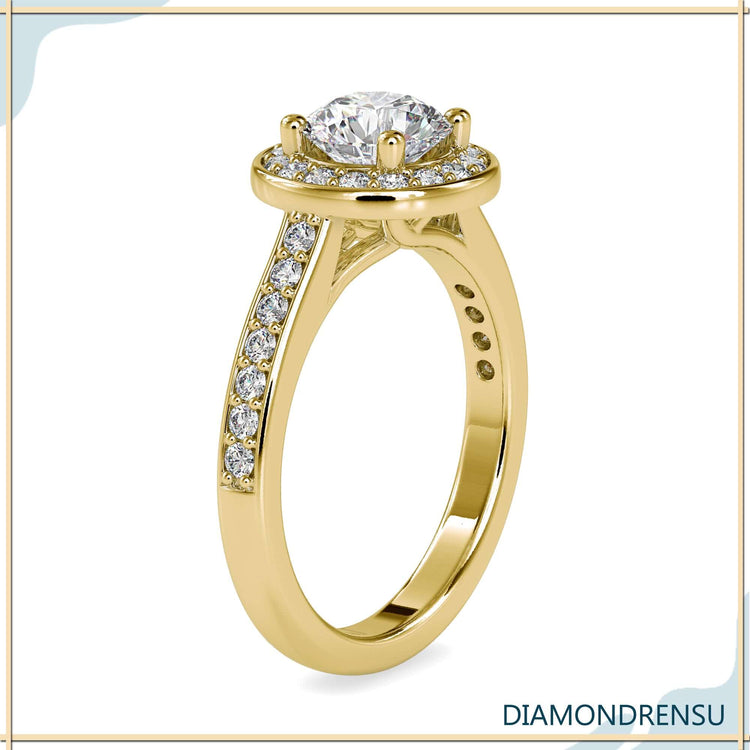 Lab grown diamond ring with round cut and halo pave band.
