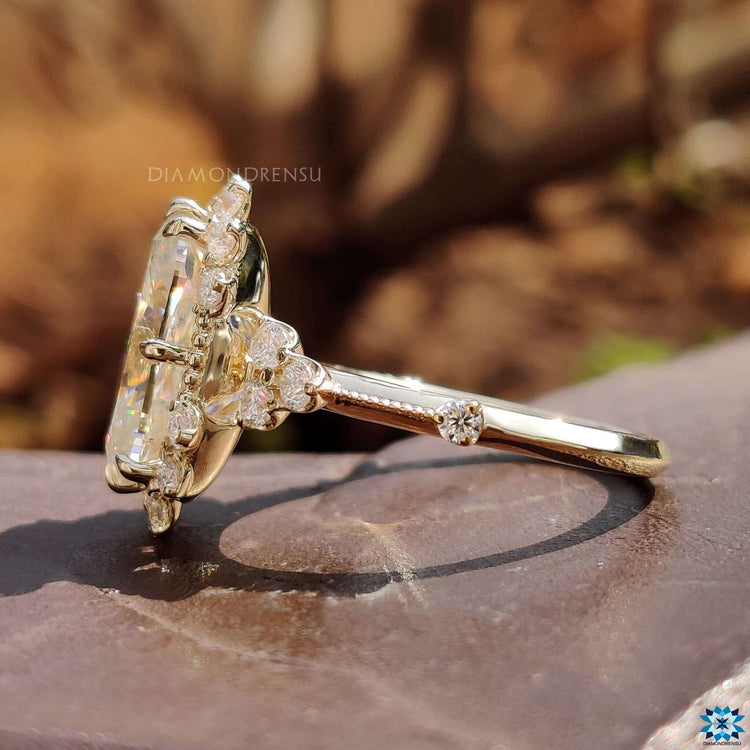 Yellow gold ring featuring round cut moissanite.
