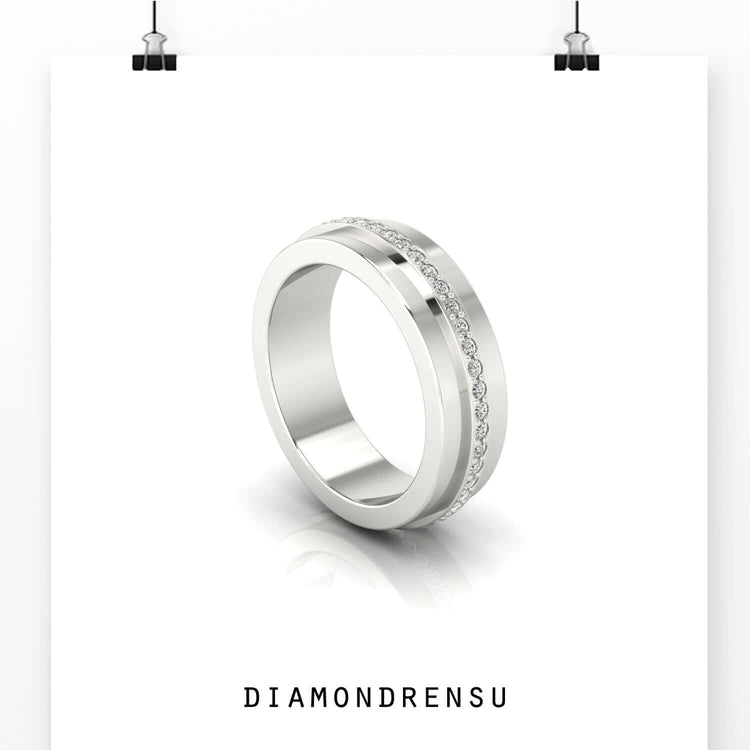 Yellow gold mens band styled with eternity diamond setting.
