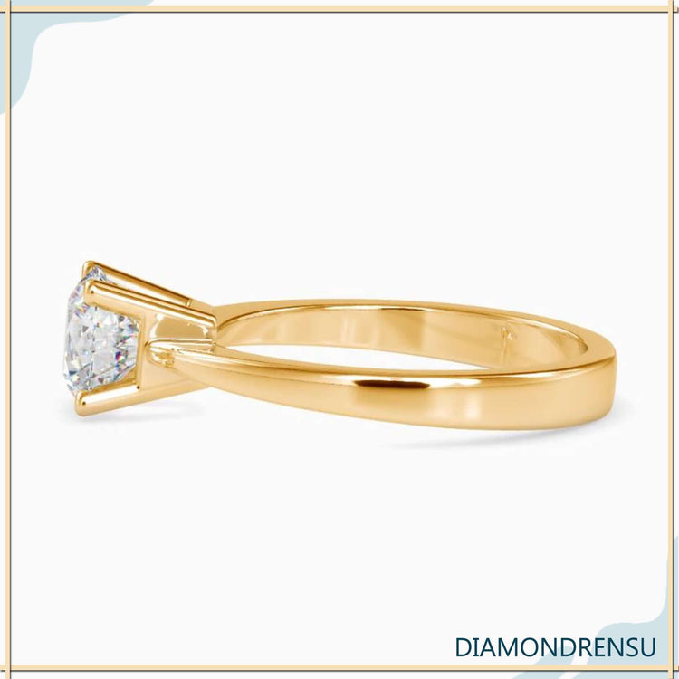White gold engagement ring with tapered shank and lab grown diamond.
