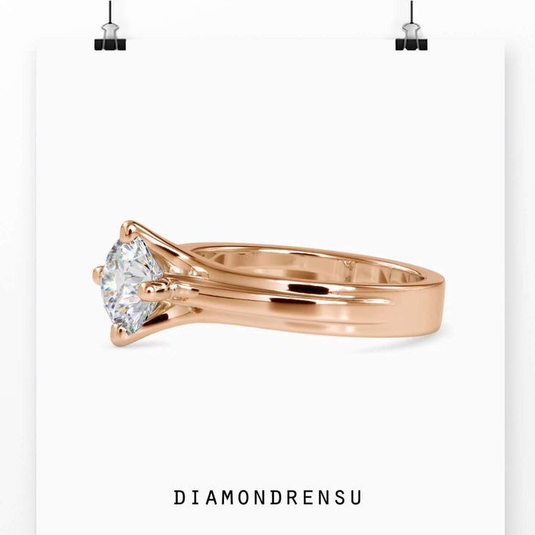 Customise engagement ring with round cut diamond and handmade design.
