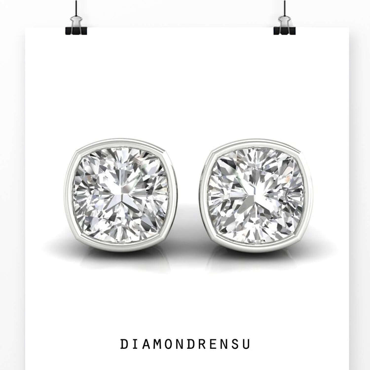 Cushion cut diamond earrings crafted in white gold.
