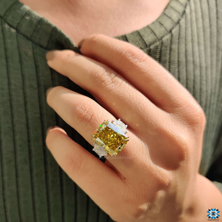 Handmade white gold ring with radiant and trapezoid cuts.
