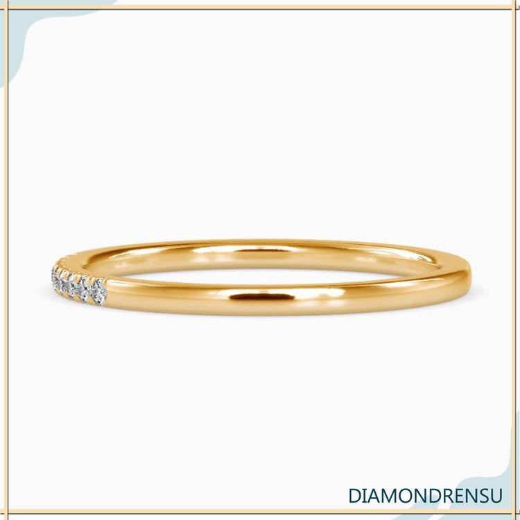 Handmade band with 1/4 eternity round cut stones.
