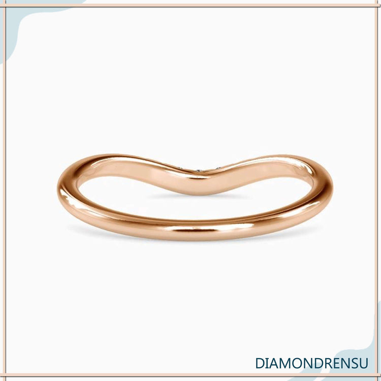 Lab grown diamond wedding band in curved style.
