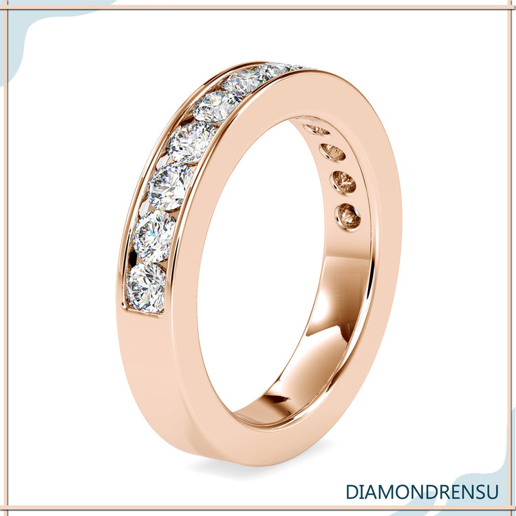 Yellow gold channel band with secure diamond setting.
